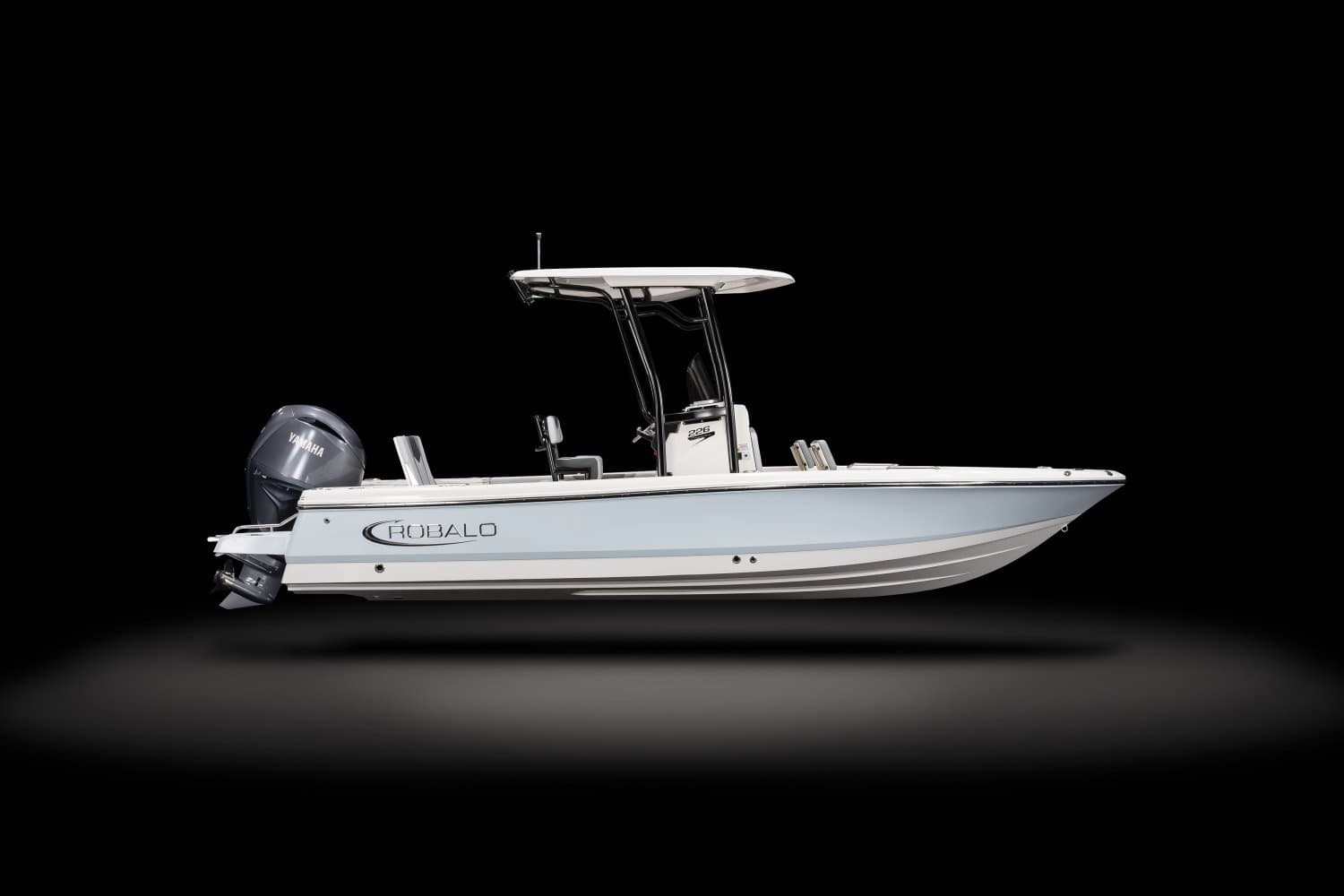 Robalo 226 Cayman bay boat on a black studio background — full starboard profile with the seafoam hull, T-top and Yamaha outboard.